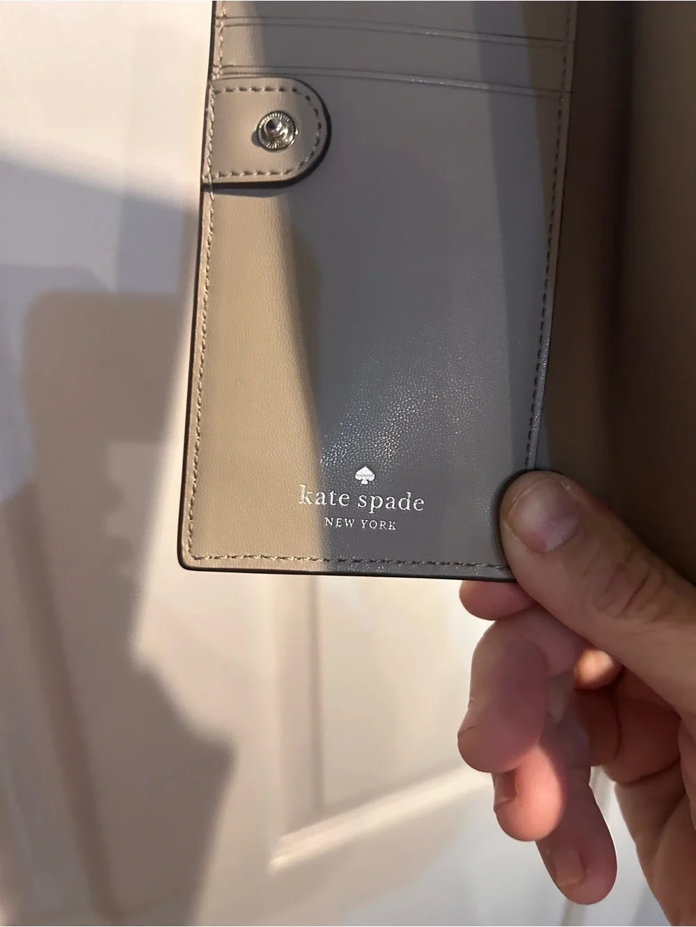 kate spade madison large slim bifold gray leather wallet with gold logo